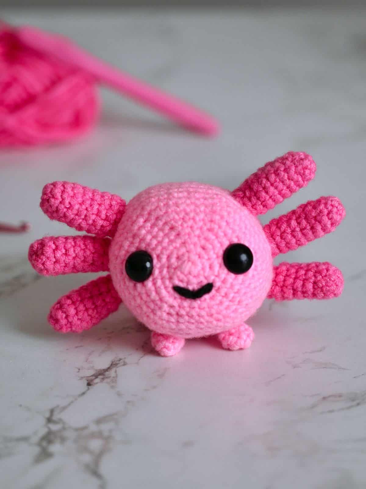 A crochet axolotl toy.